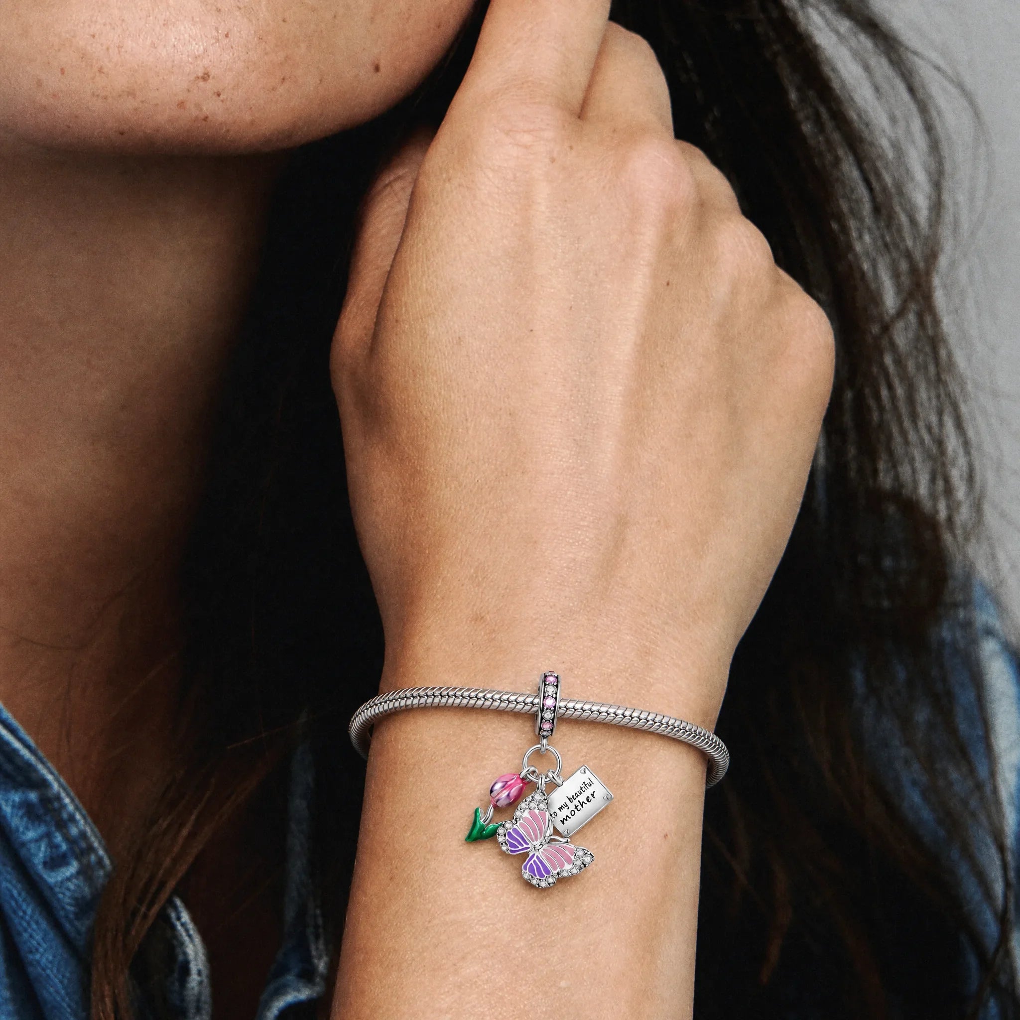 Meaningful silver heart message charm worn on a delicate necklace
