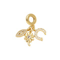 Evil Eye, Flower & Crescent Dangle Charm in gold-plated copper on white background