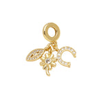 Evil Eye, Flower & Crescent Dangle Charm in gold-plated copper on white background