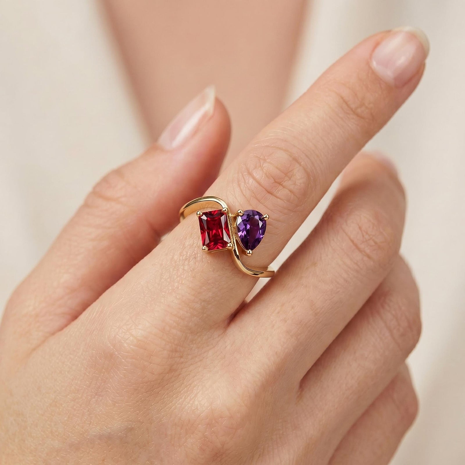 Custom two stone birthstone ring in 18K gold plated finish worn on hand