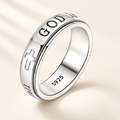 CALEO God Is Within Her silver spinner ring on warm ivory background