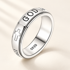 CALEO God Is Within Her silver spinner ring on warm ivory background
