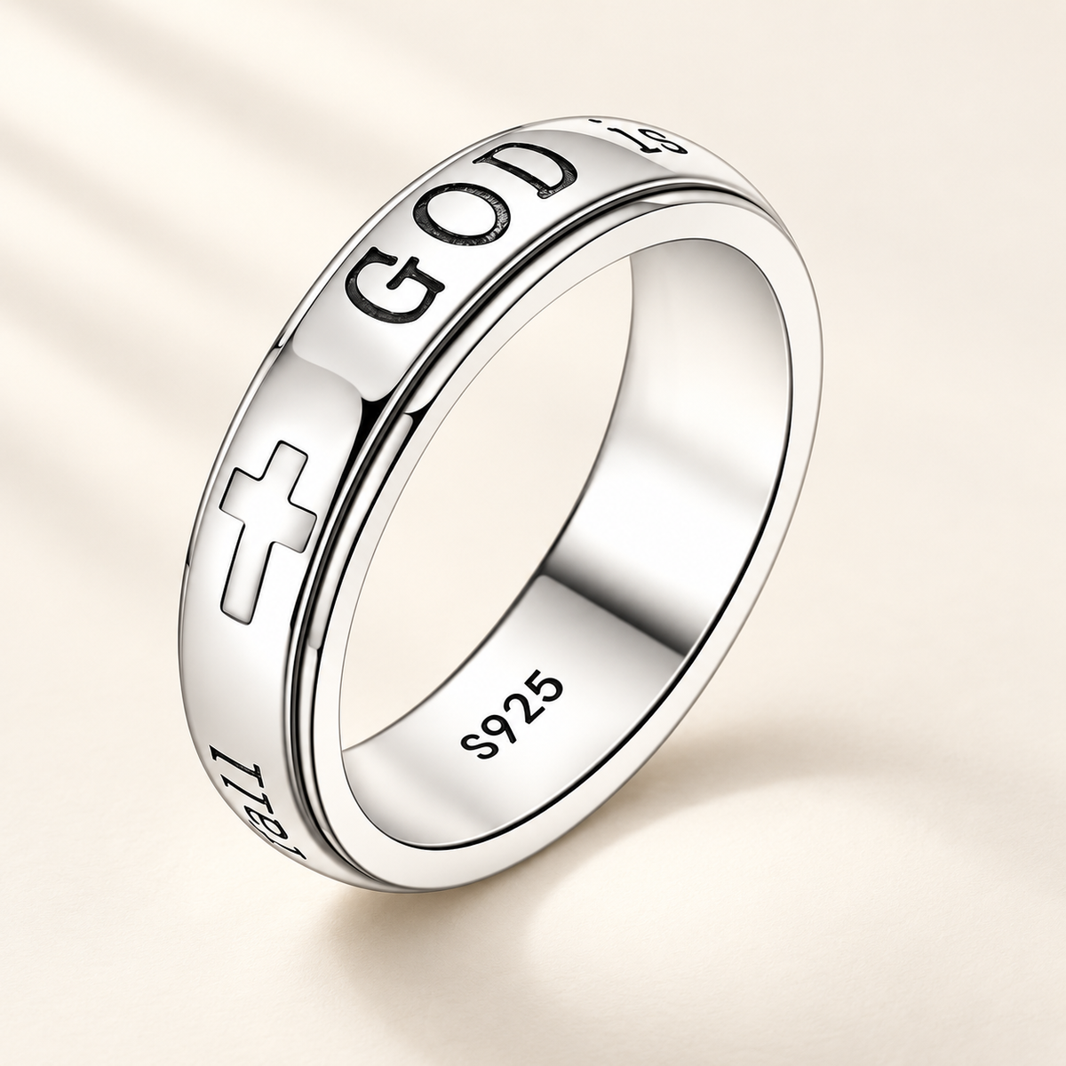 CALEO God Is Within Her silver spinner ring on warm ivory background