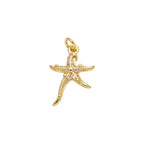 Crystal Starfish Dangle Charm in gold-plated copper on white background