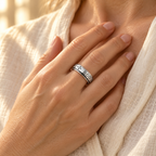 Woman wearing the CALEO God Is Within Her spinner ring over her heart