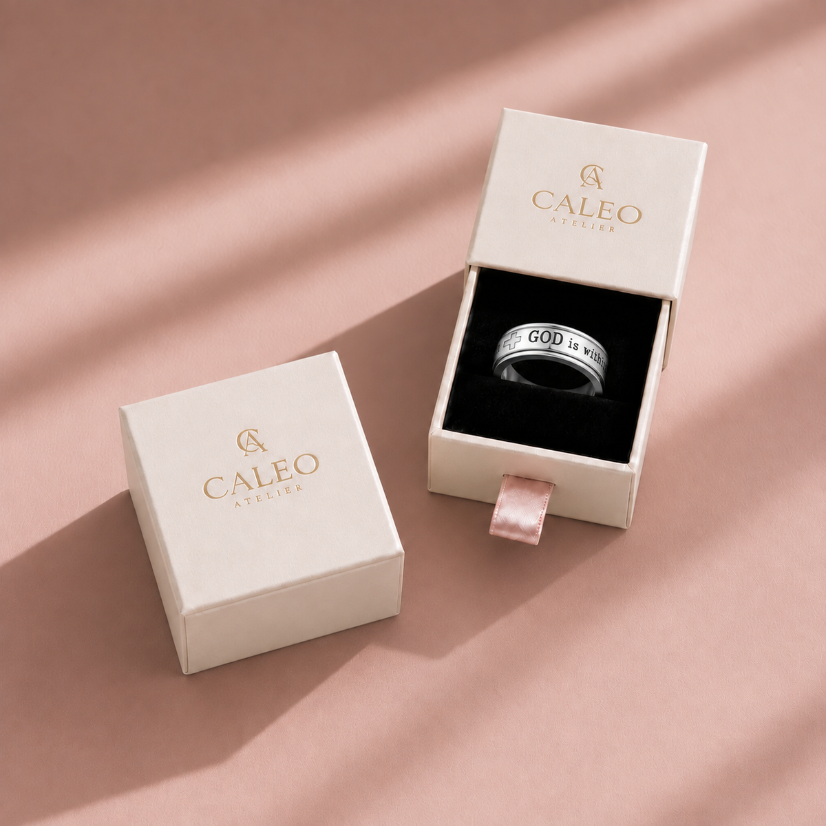CALEO God Is Within Her silver spinner ring in the authentic cream drawer gift box