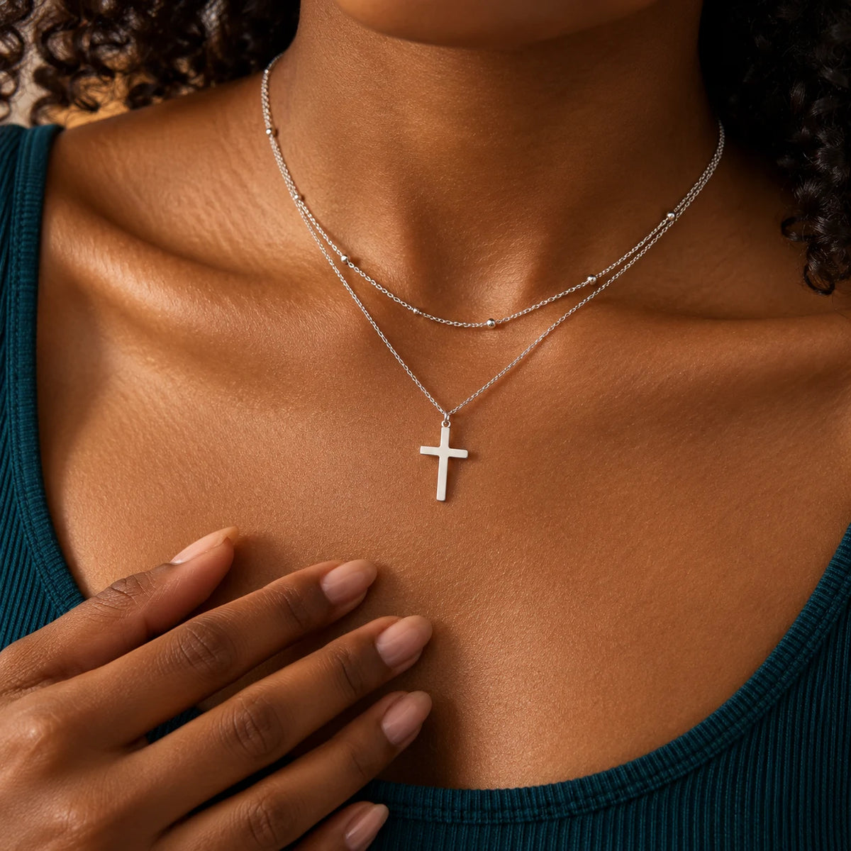 Silver Faithbound Layered Cross Necklace worn against a neutral outfit