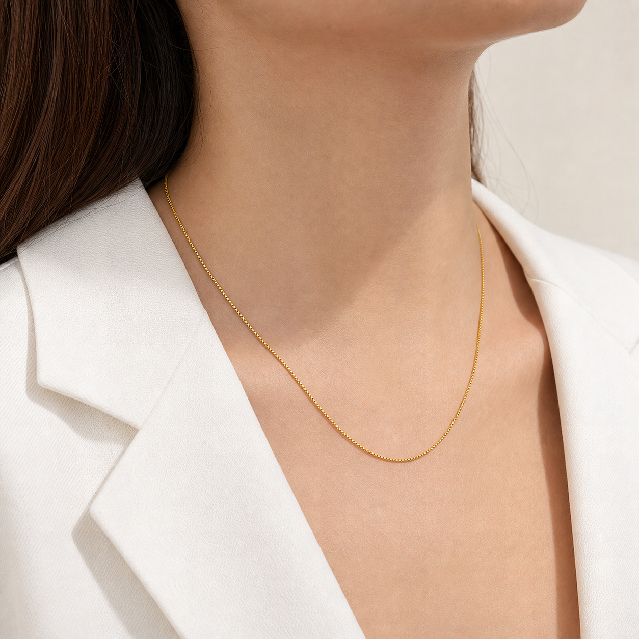 Classic Box Chain Necklace in gold styled with a white blazer