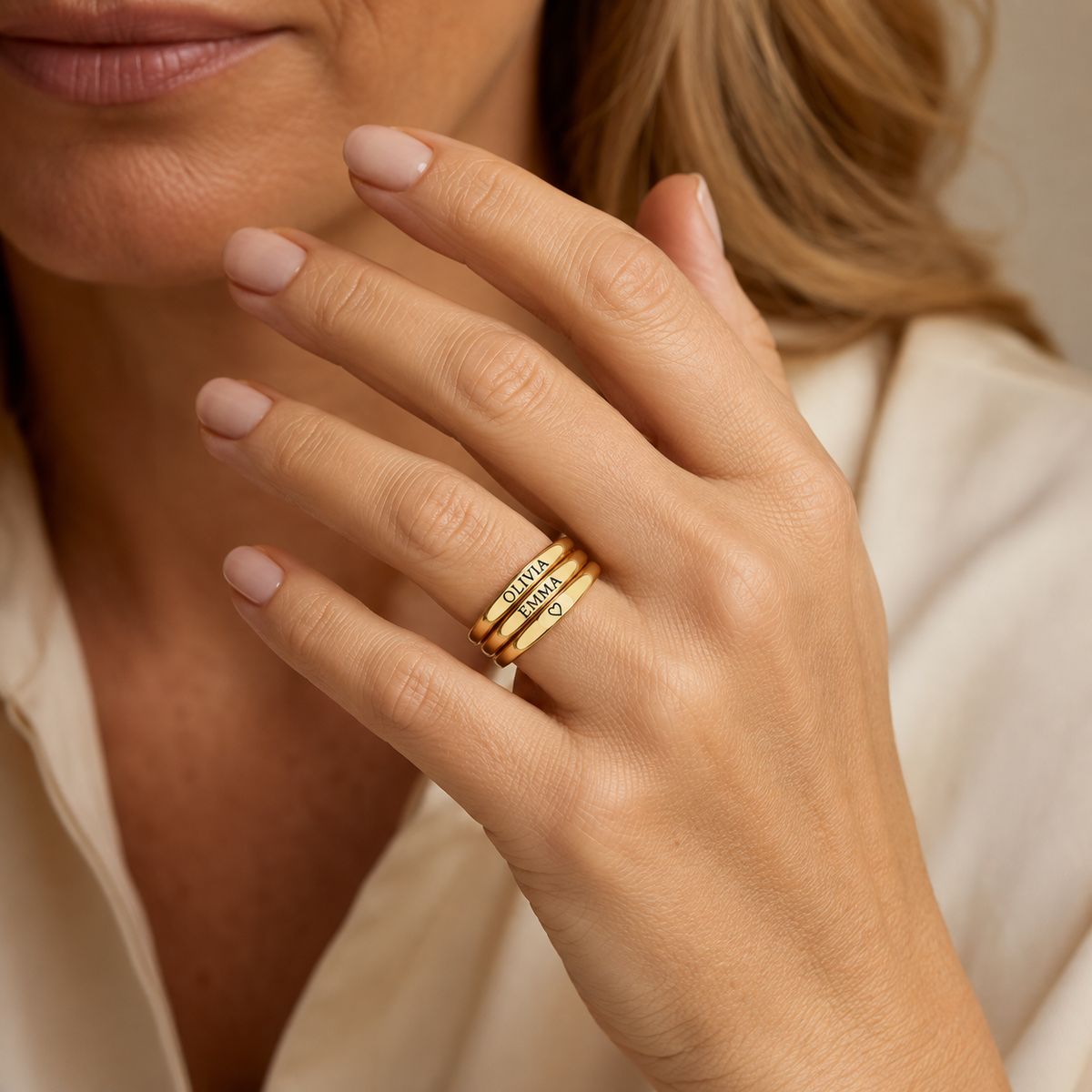 Stack of three custom engraved gold rings