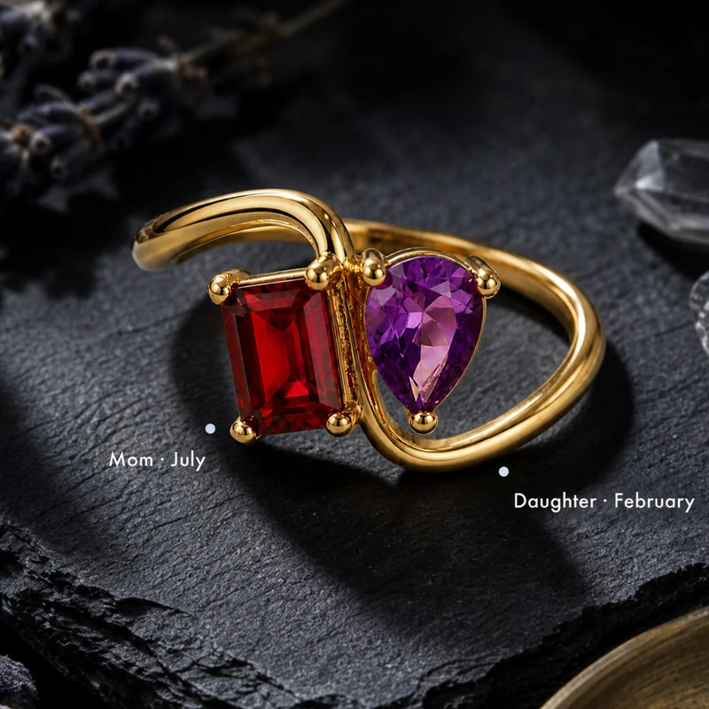 Gold ring using two birthstone colors to represent a mother and daughter