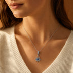 Blue North Star Dangle Charm worn on a delicate necklace