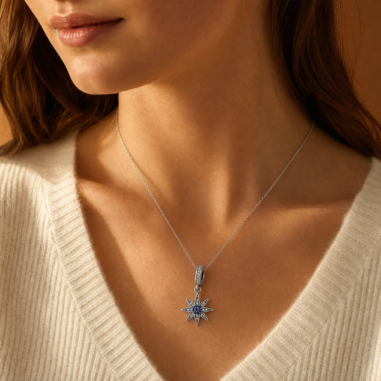 Blue North Star Dangle Charm worn on a delicate necklace