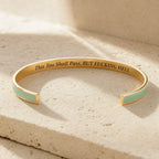 This Too Shall Pass color cuff bracelet showing the full engraved message inside