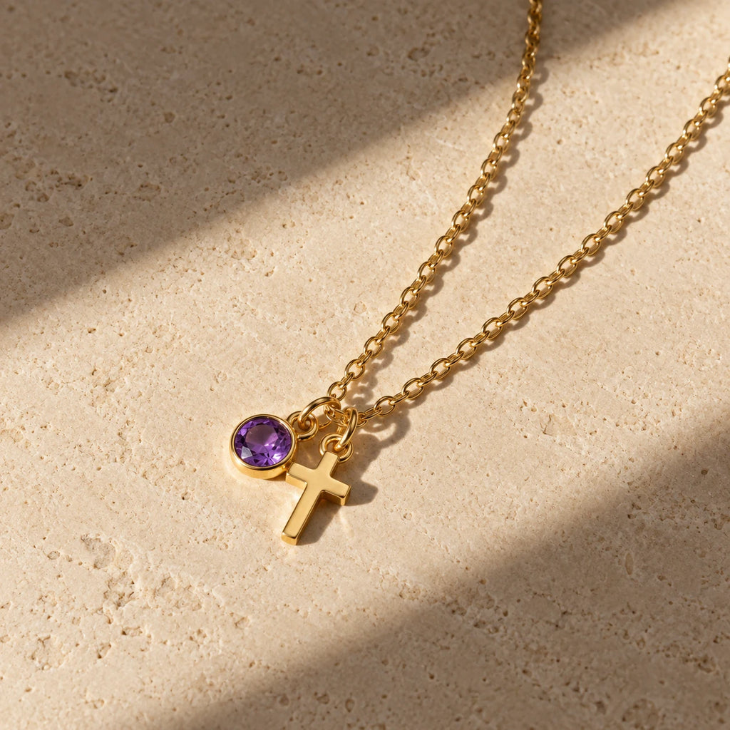Birthstone Grace Cross Necklace - lifestyle gold amethyst flatlay