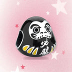 CALEO Japanese charm thumbnail - Black Daruma Doll Charm - pink star background - 2026-07-22