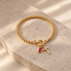 Blessed Birthstone Cross Bracelet - blessed birthstone cross bracelet ruby still life