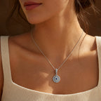 Blue Celestial Sun Medallion Dangle Charm worn on a delicate necklace