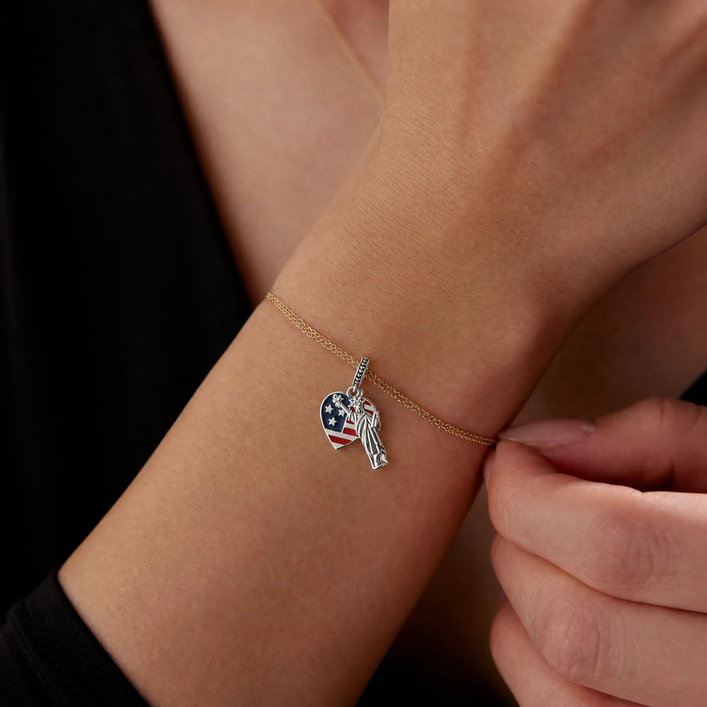 American heritage charm worn on a delicate bracelet
