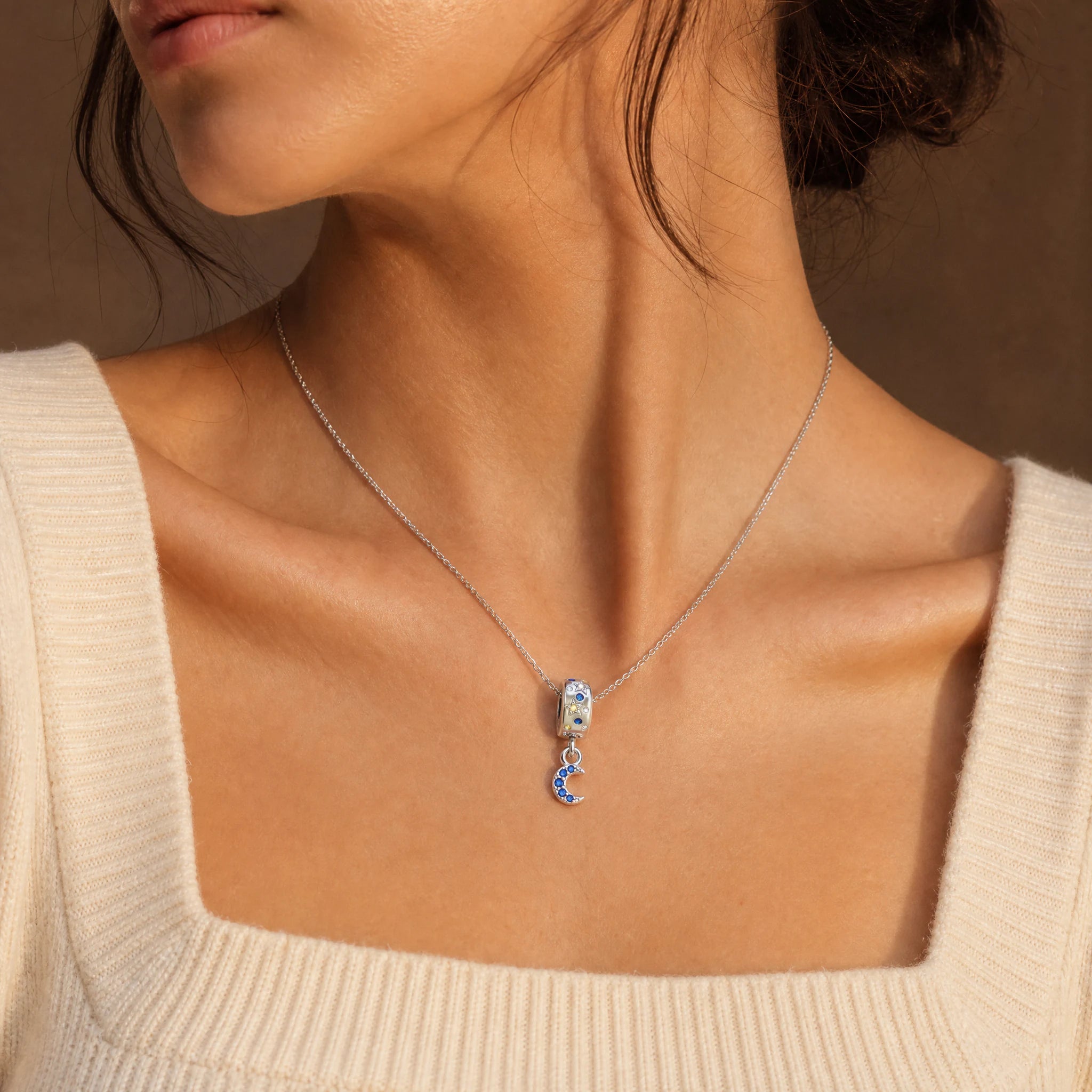 Celestial Moon & Stars Dangle Charm worn on a delicate necklace