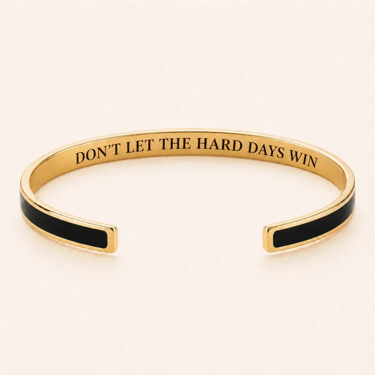 Don't Let The Hard Days Win cuff bracelet - Gold finish, Black enamel, full quote
