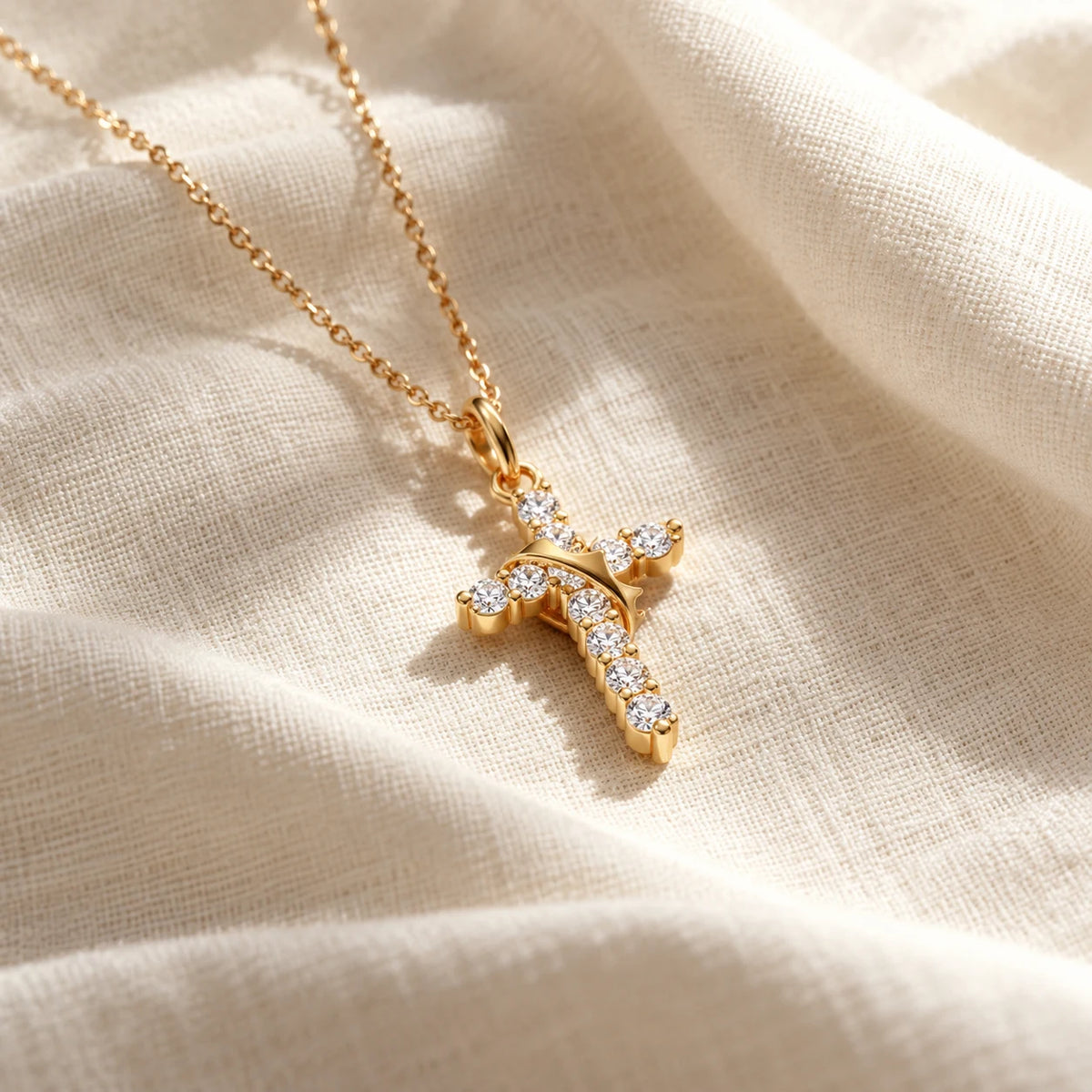 Crowned Grace Cross Necklace - gold linen still life