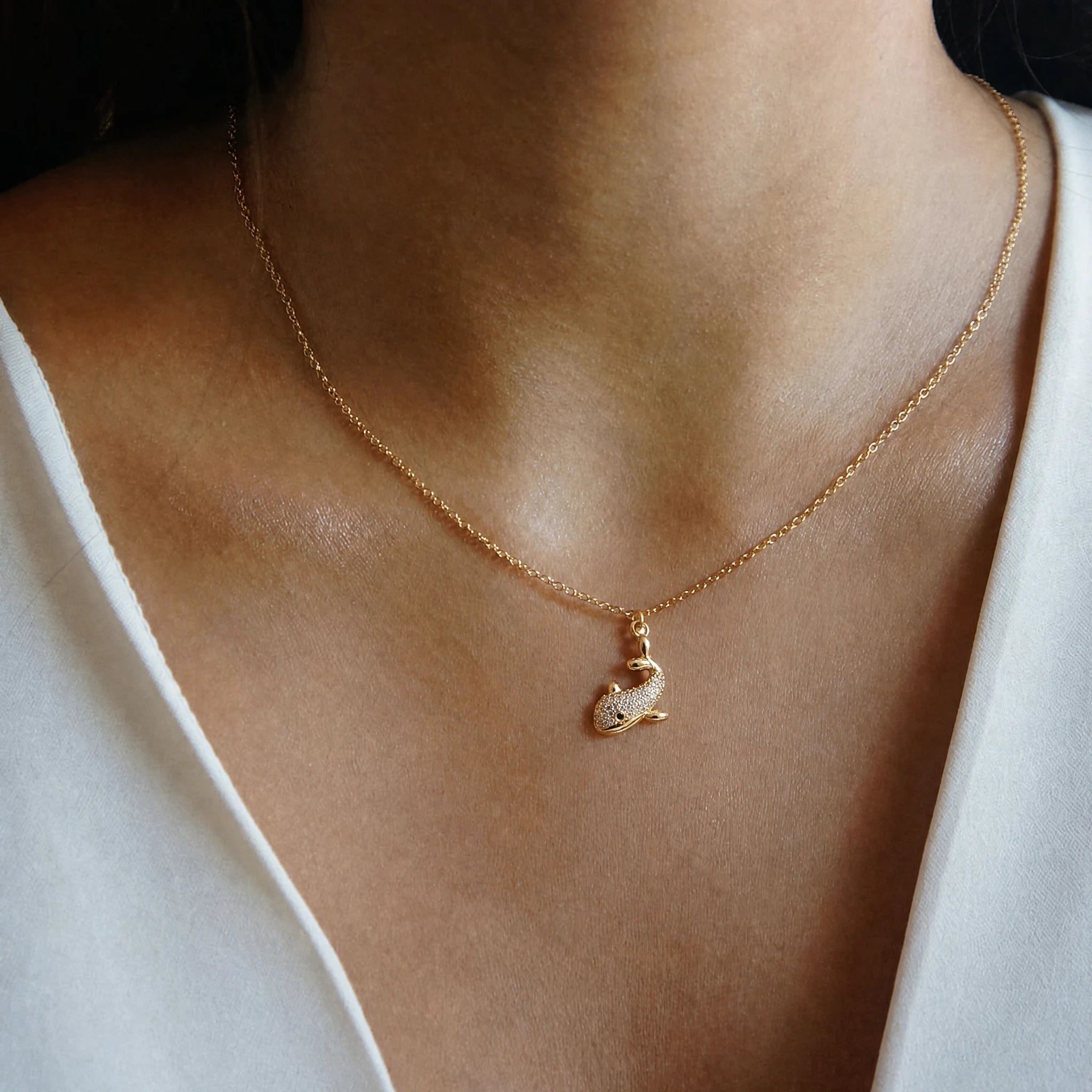 Crystal Whale Dangle Charm worn on a delicate necklace