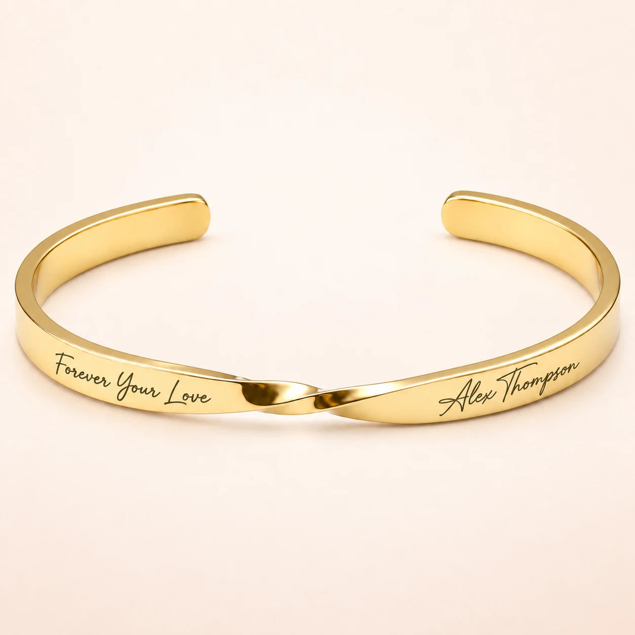 Gold Custom Engraved Twist Cuff Bracelet on blush ivory background