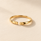 Double Initial Name Ring — neutral product still life