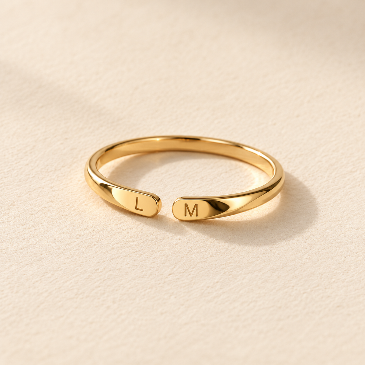Double Initial Name Ring — neutral product still life
