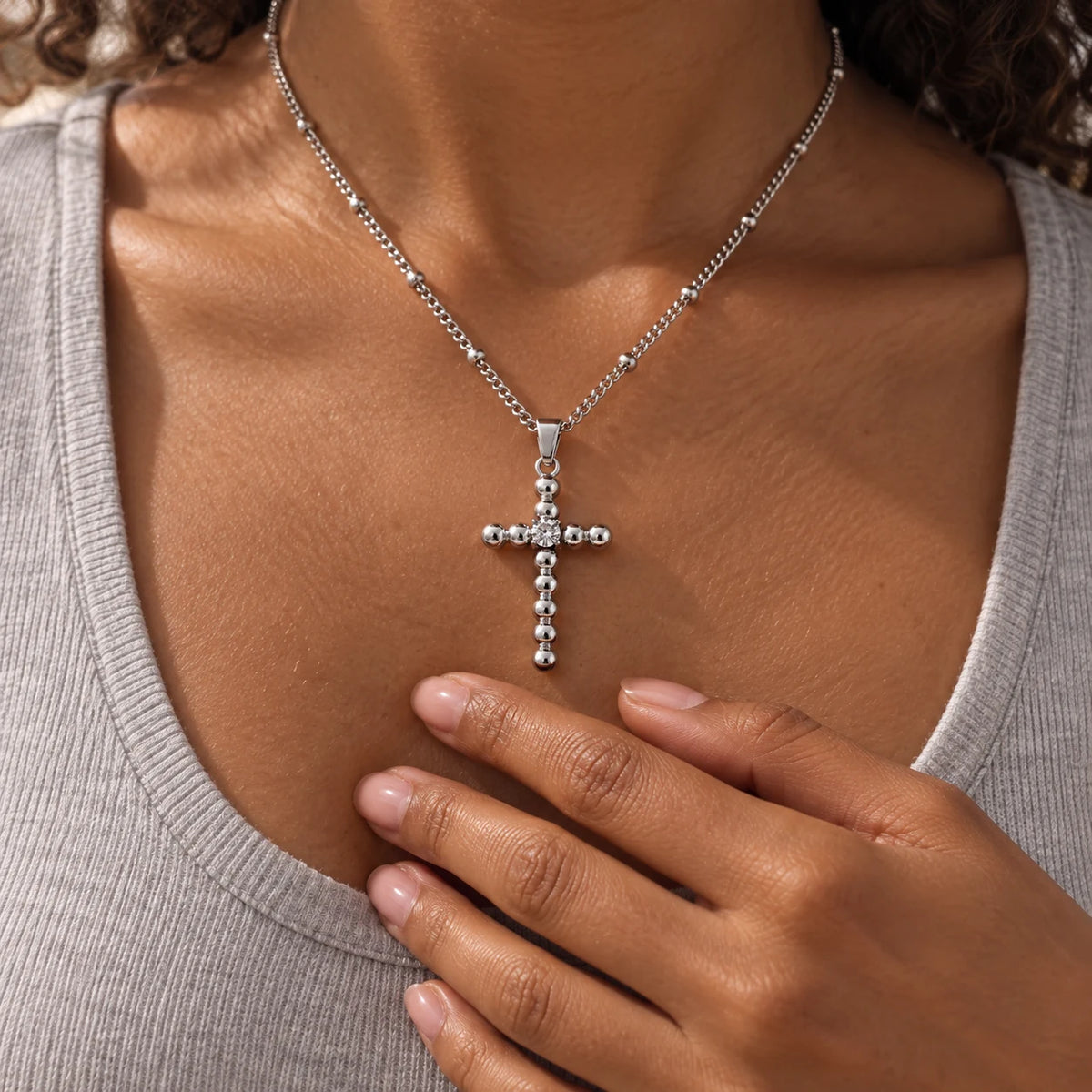 Glimmer Bead Cross Necklace - lifestyle silver hand