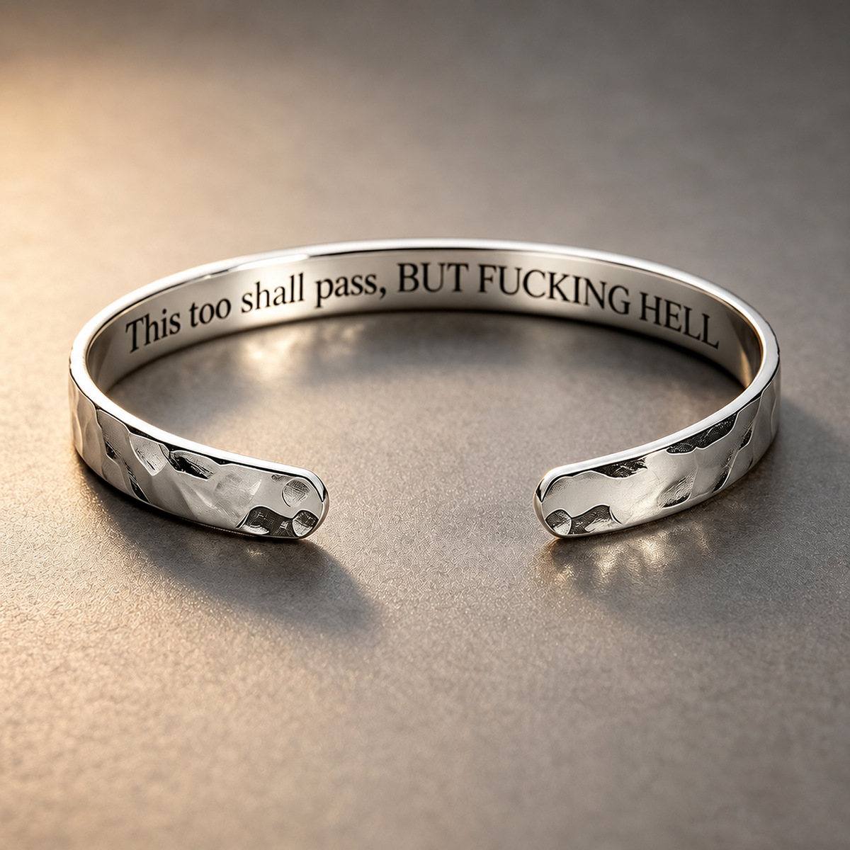 Silver hammered cuff in a warm studio setting