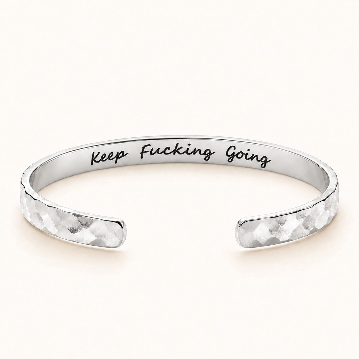 Silver hammered cuff with Keep Fucking Going private inside engraving