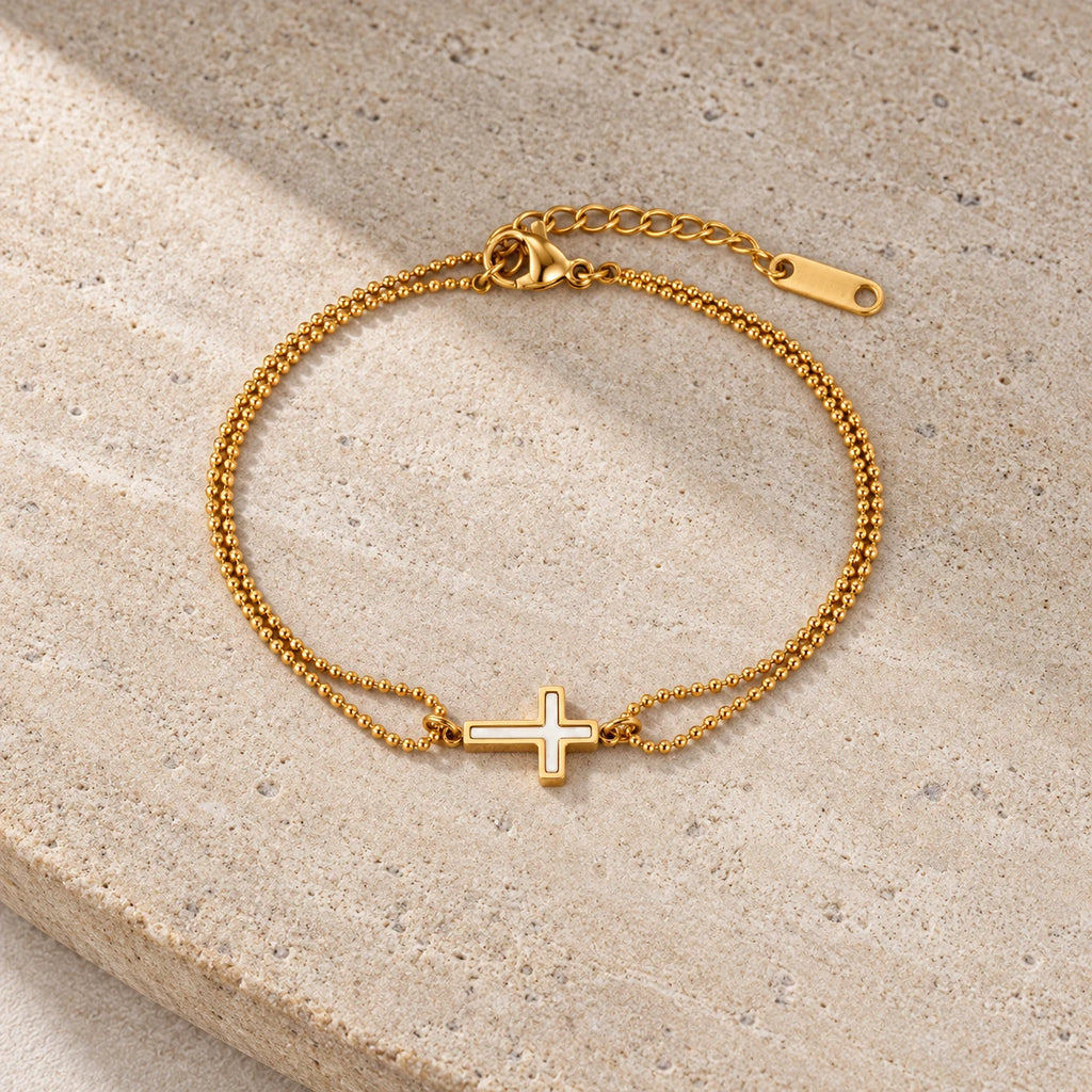 Ivory Grace Cross Bracelet - editorial gold stone