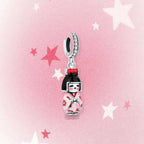 CALEO Japanese charm thumbnail - Japanese Kokeshi Doll Dangle Charm - pink star background - 2026-07-22