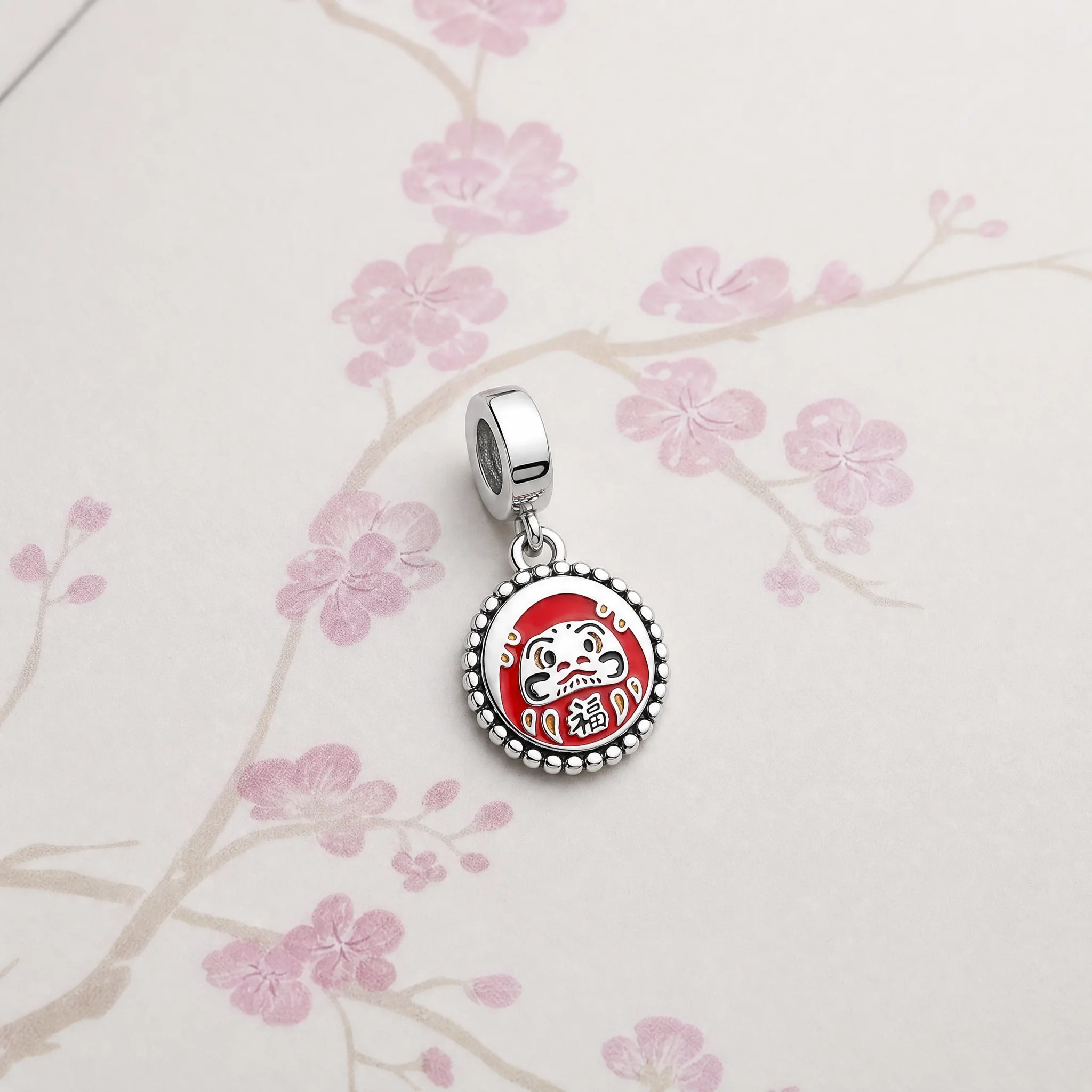 CALEO Japonism lifestyle image - Daruma Fortune Medallion Dangle Charm - japonism-refbatch-ref09-daruma-fortune-medallion-dangle-charm - 2026-07-27