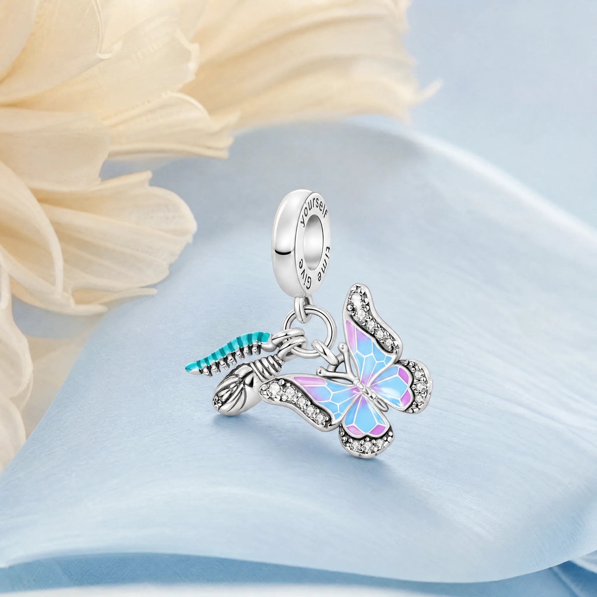CALEO Nature & Flowers color-matched lifestyle image - Hummingbird & Butterfly Dangle Charm - nature-flowers-color-blue-ref04-hummingbird-butterfly-dangle-charm - 2026-07-27