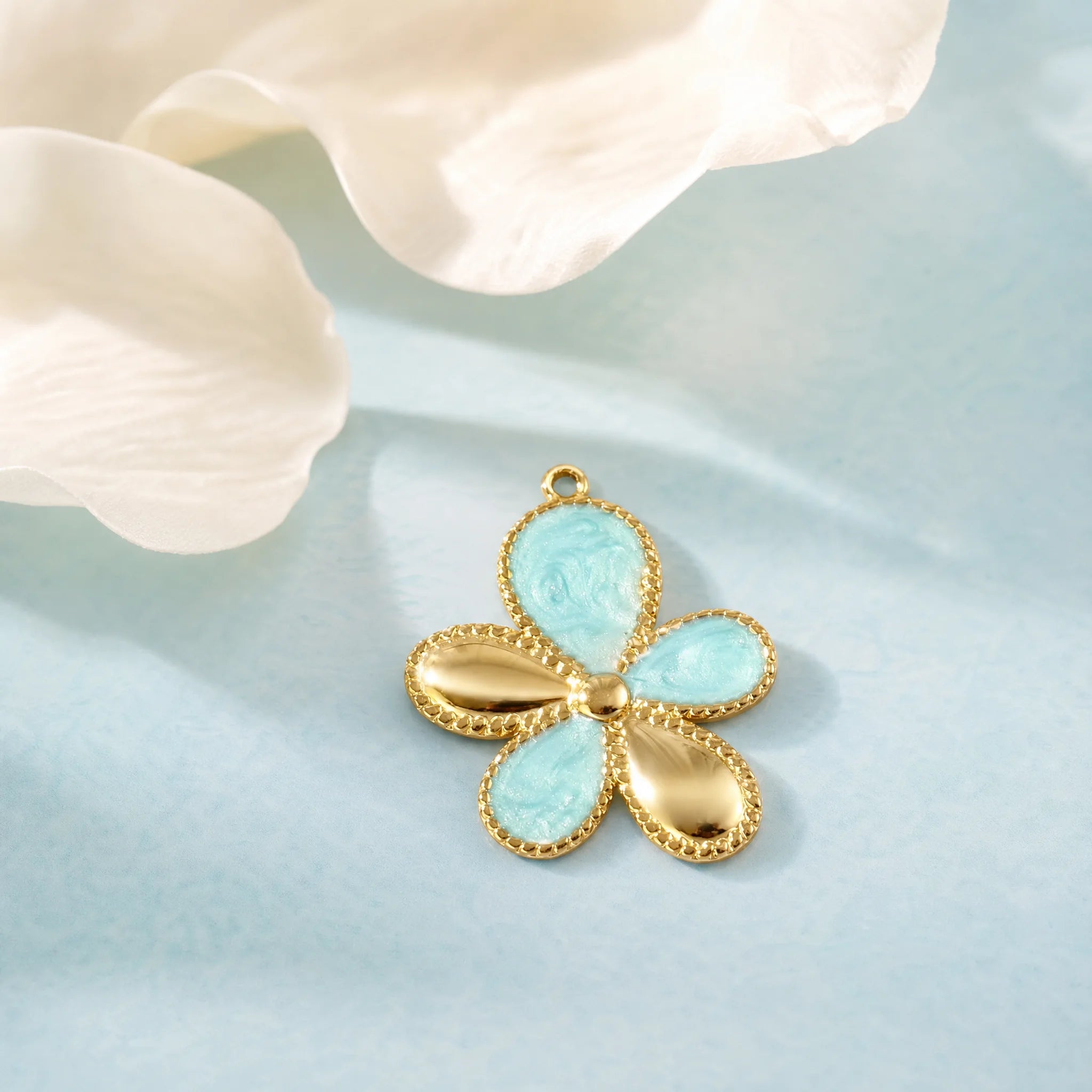 CALEO Nature & Flowers color-matched lifestyle image - Gold Blue Petal Flower Pendant Charm - nature-flowers-color-blue-ref05-gold-blue-petal-flower-pendant-charm - 2026-07-27