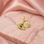 CALEO Nature & Flowers color-matched lifestyle image - Gold Bee Love Dangle Charm - nature-flowers-color-gold-ref19-gold-bee-love-dangle-charm - 2026-07-27