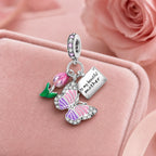 CALEO Nature & Flowers color-matched lifestyle image - Pink Butterfly Love Letter Dangle Charm - nature-flowers-color-pink-ref14-pink-butterfly-love-letter-dangle-charm - 2026-07-27