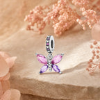 CALEO Nature & Flowers color-matched lifestyle image - Pink Crystal Butterfly Dangle Charm - nature-flowers-color-pink-ref17-pink-crystal-butterfly-dangle-charm - 2026-07-27