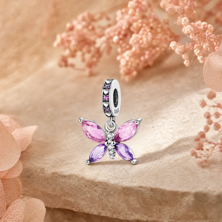 CALEO Nature & Flowers color-matched lifestyle image - Pink Crystal Butterfly Dangle Charm - nature-flowers-color-pink-ref17-pink-crystal-butterfly-dangle-charm - 2026-07-27
