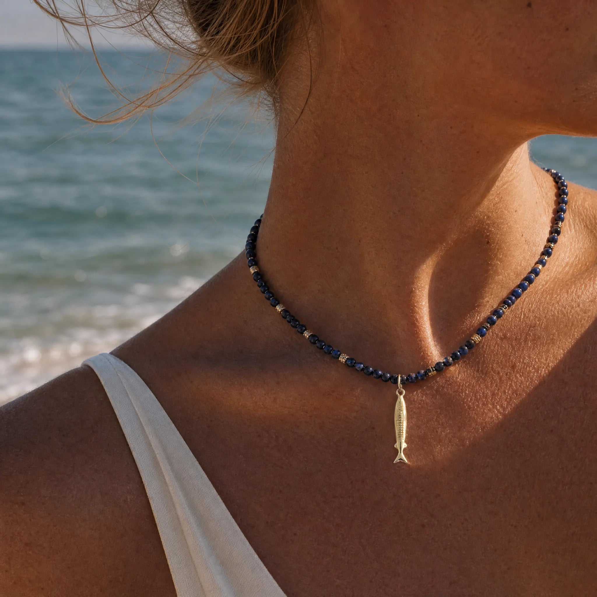 CALEO ocean lifestyle image - Gold Sardine Pendant Charm - ocean-extra-ref18-gold-sardine-pendant-charm - 2026-07-23