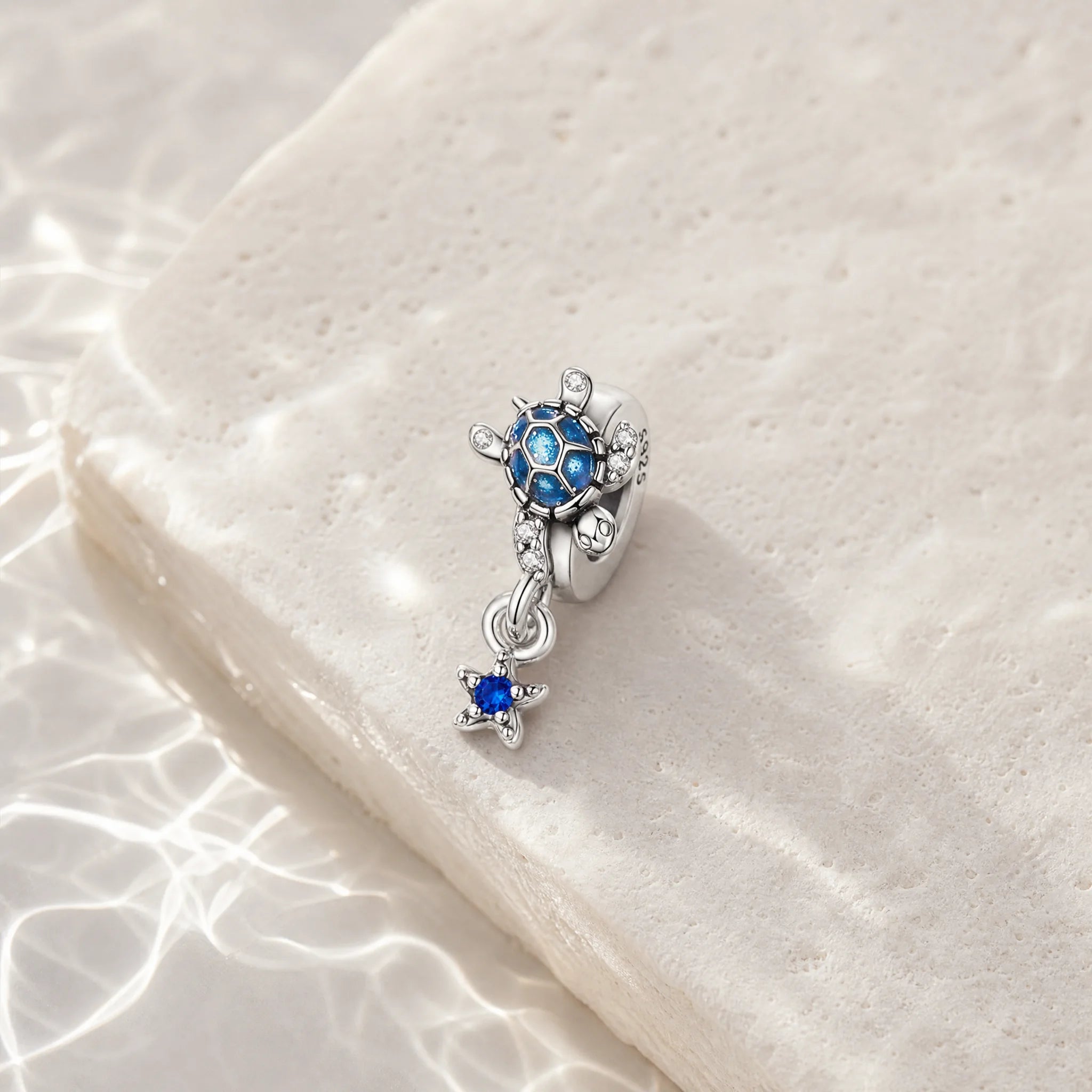 CALEO ocean lifestyle image - Blue Starfish & Dolphin Dangle Charm - ocean-ref01-blue-starfish-dolphin-dangle-charm - 2026-07-23