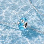 CALEO ocean lifestyle image - Blue Dolphin Moon Bead Charm - ocean-ref02-blue-dolphin-moon-bead-charm - 2026-07-23