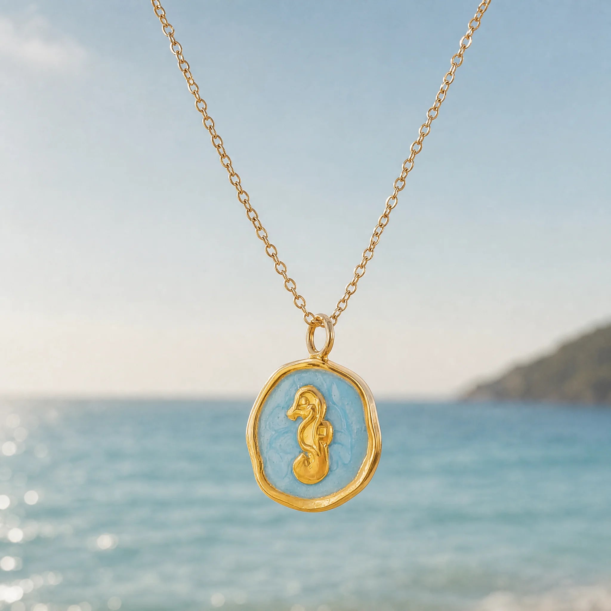 CALEO ocean lifestyle image - Gold Blue Seahorse Medallion Pendant Charm - ocean-ref06-gold-blue-seahorse-medallion-pendant-charm - 2026-07-23