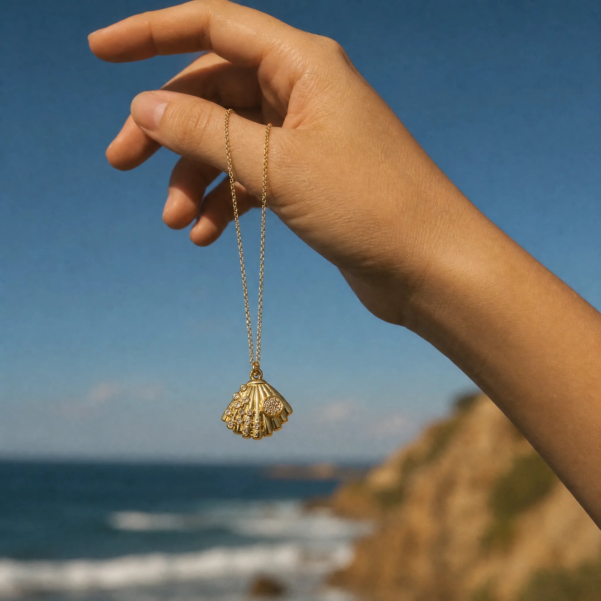 CALEO ocean lifestyle image - Crystal Fan Shell Dangle Charm - ocean-ref07-crystal-fan-shell-dangle-charm - 2026-07-23