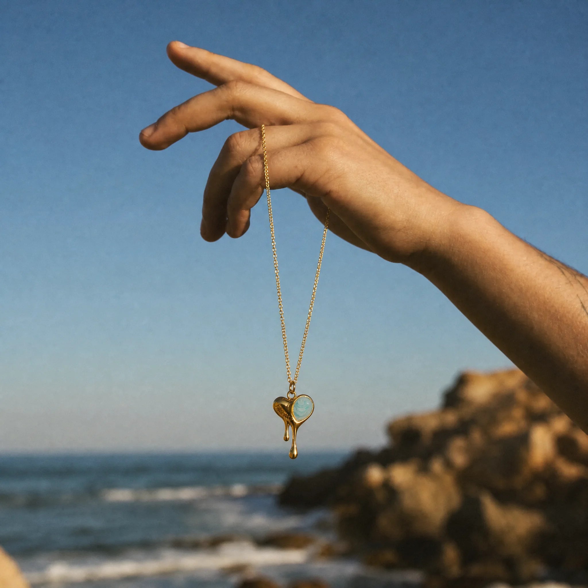 CALEO ocean lifestyle image - Gold Blue Shell Heart Pendant Charm - ocean-ref07-gold-blue-shell-heart-pendant-charm - 2026-07-23
