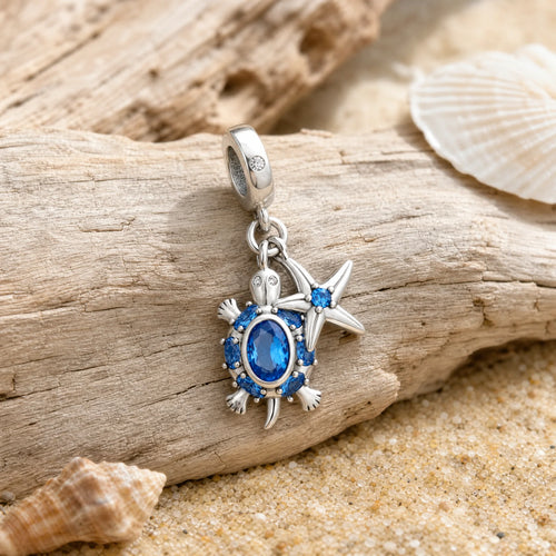 CALEO ocean lifestyle image - Blue Starfish & Compass Dangle Charm - ocean-ref09-blue-starfish-compass-dangle-charm - 2026-07-23