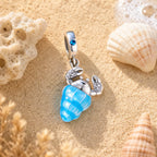CALEO ocean lifestyle image - Glow-in-the-Dark Seashell & Ship Dangle Charm - ocean-ref11-glow-in-the-dark-seashell-ship-dangle-charm - 2026-07-23