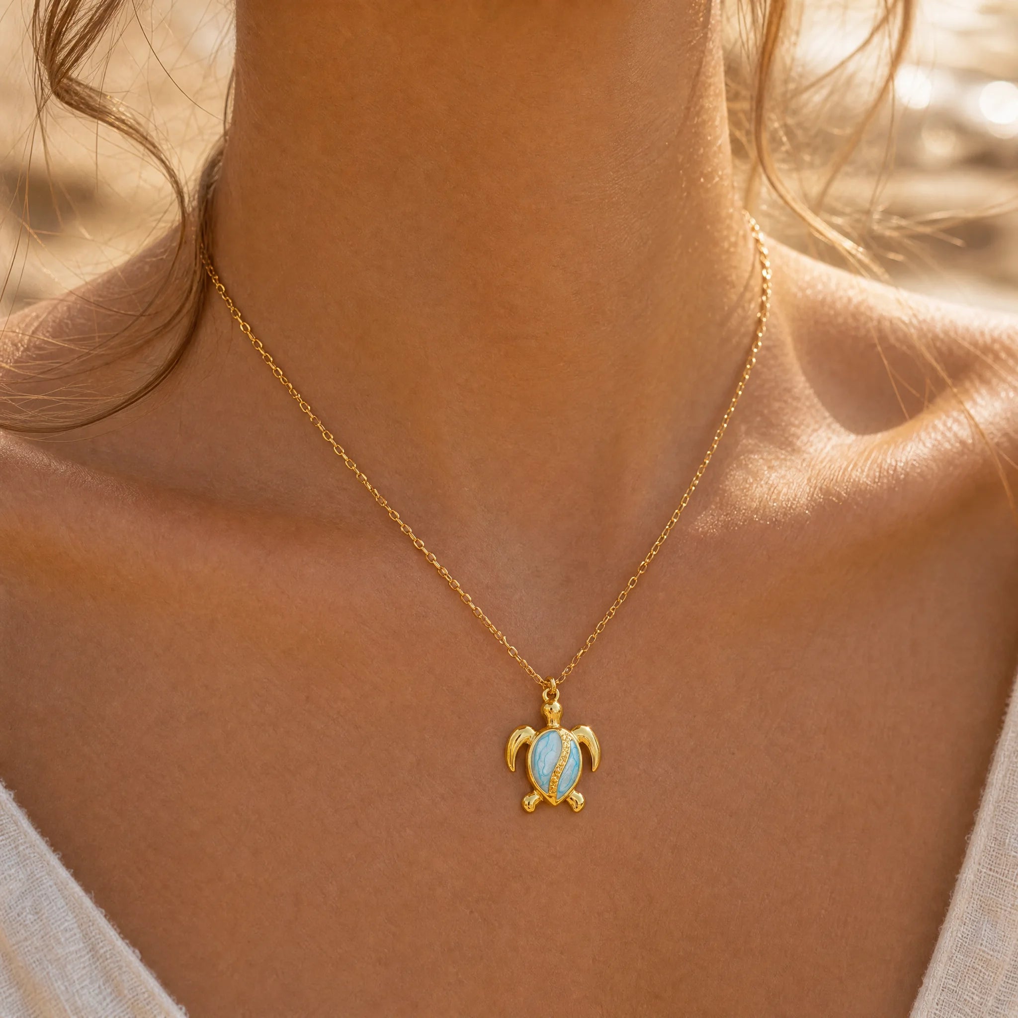 CALEO ocean lifestyle image - Gold Blue Sea Turtle Pendant Charm - ocean-ref17-gold-blue-sea-turtle-pendant-charm - 2026-07-23